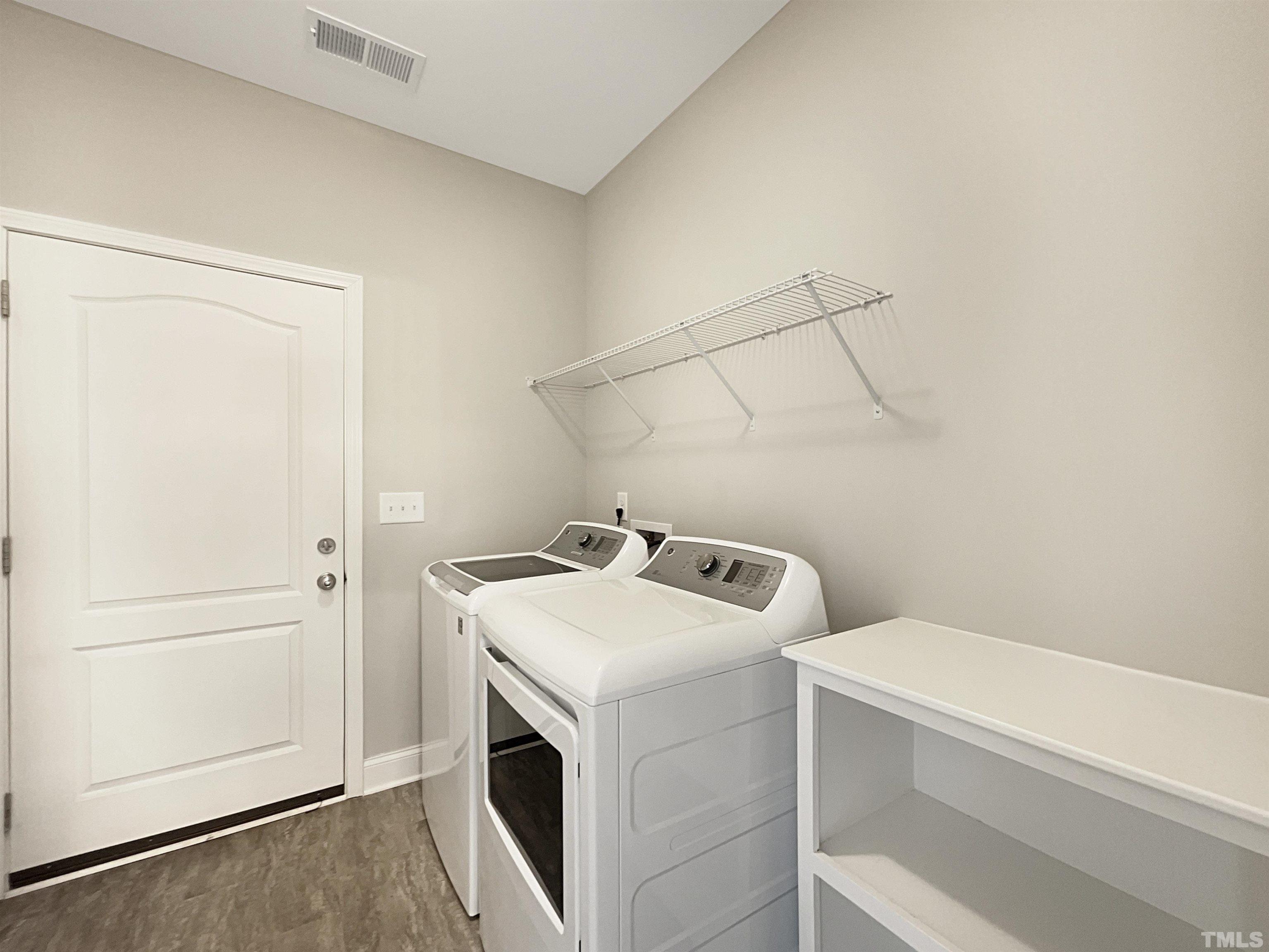 295 Edgefield Street Clayton, NC 27520 - Photo 12 of 21 a utility room with dryer and washer