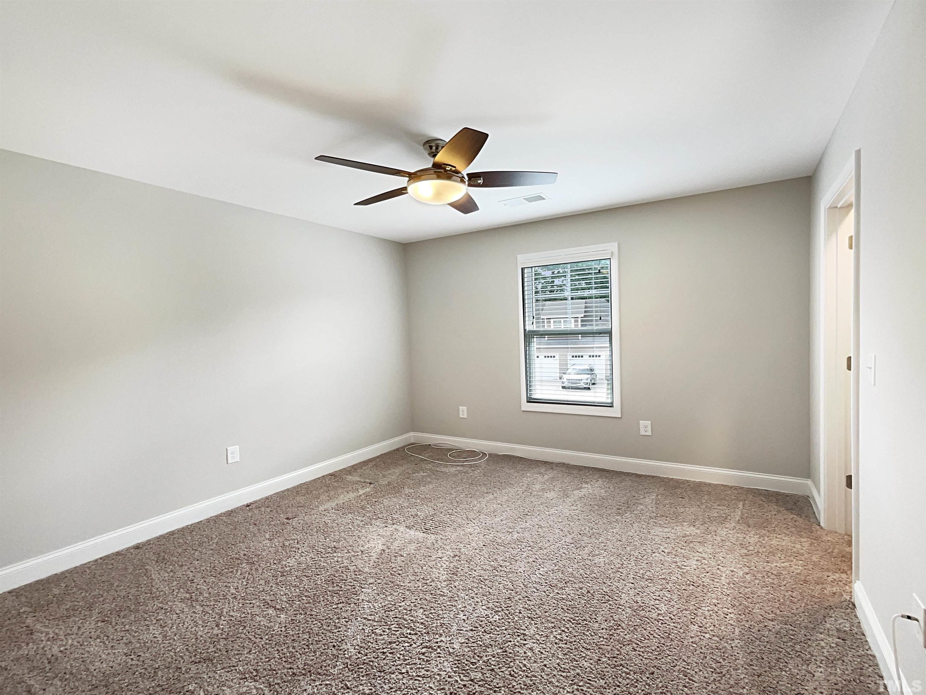 295 Edgefield Street Clayton, NC 27520 - Photo 20 of 21 a view of an empty room with a window
