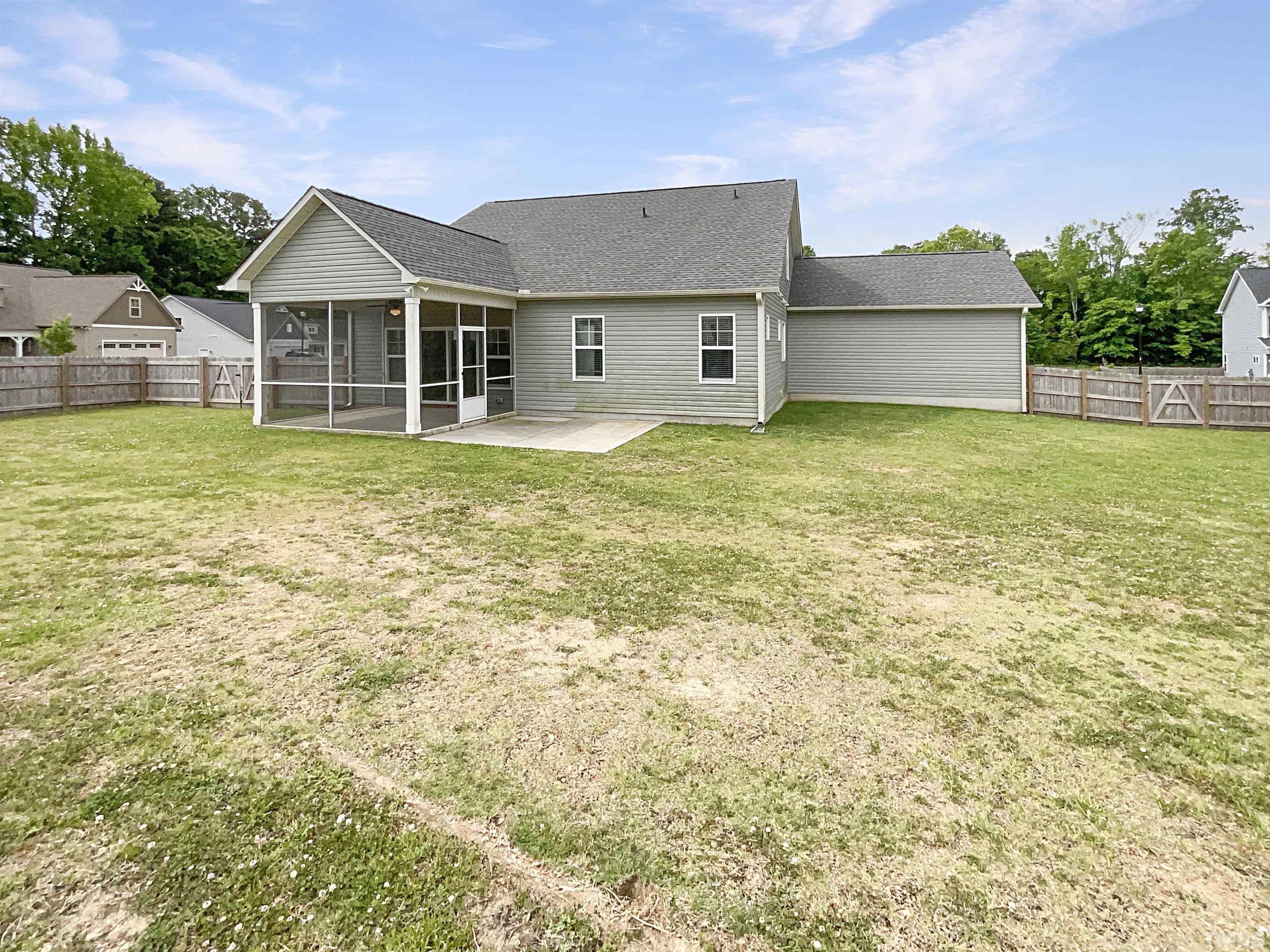 295 Edgefield Street Clayton, NC 27520 - Photo 7 of 21 a front view of a house with a garden