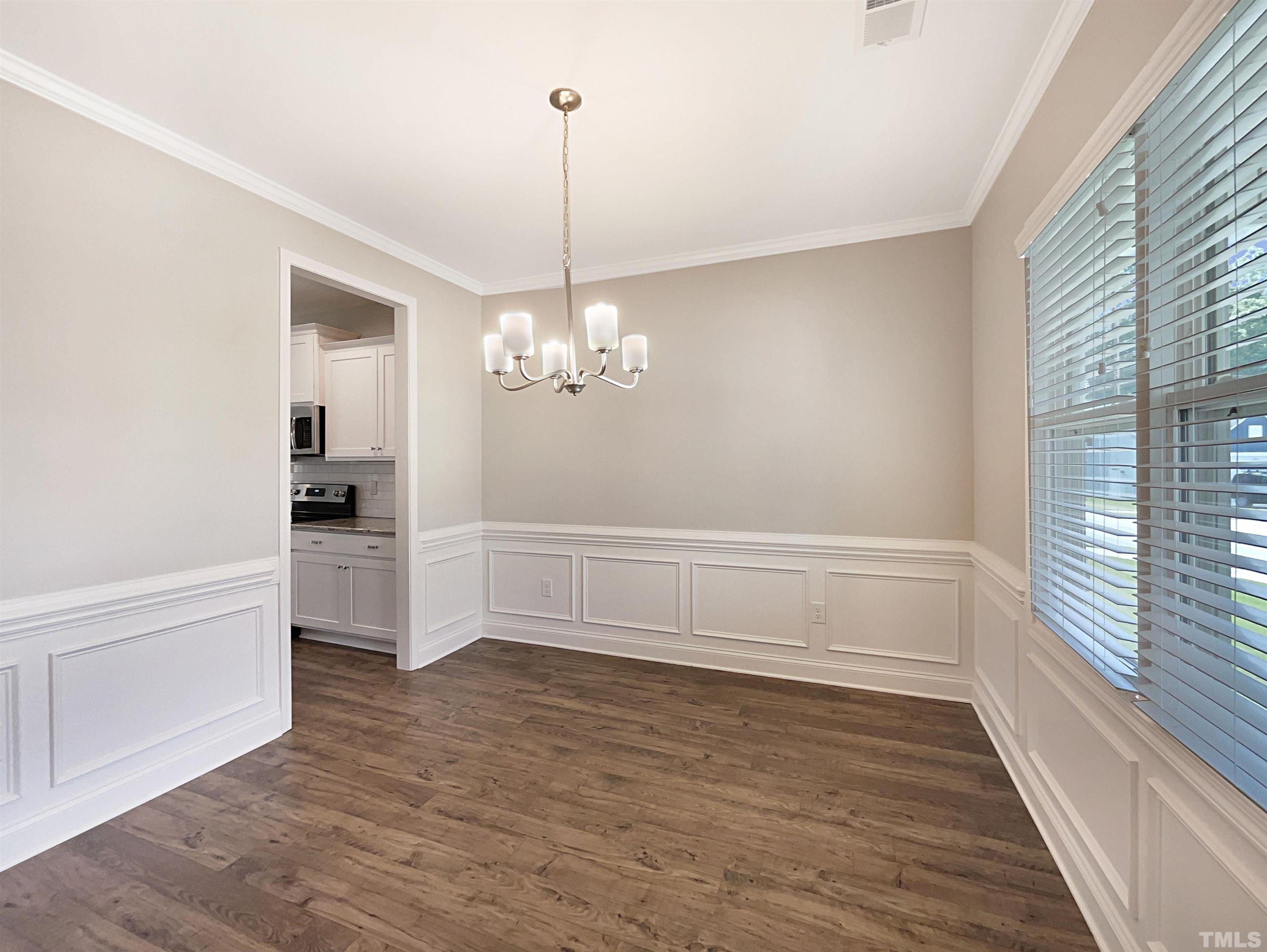 295 Edgefield Street Clayton, NC 27520 - Photo 9 of 21 a view of an empty room with a window