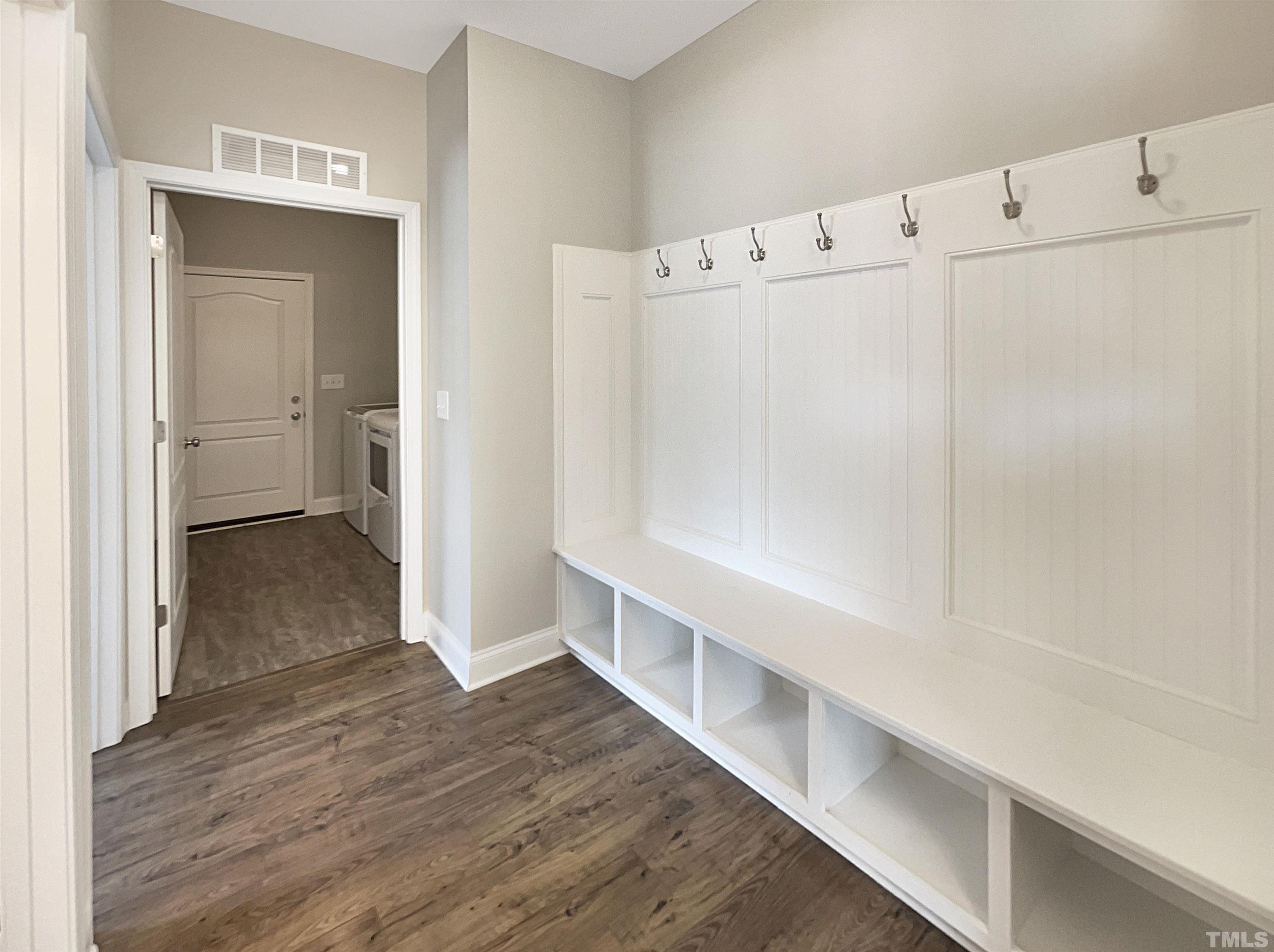 295 Edgefield Street Clayton, NC 27520 - Photo 10 of 21 a view of walk in closet with wooden floor