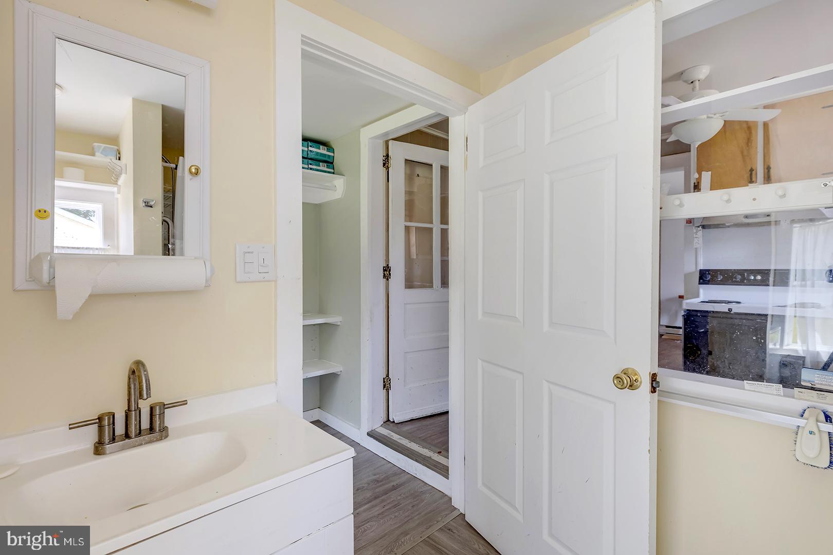 29092 Piney Neck Road Dagsboro, DE 19939 - Photo 12 of 49 a kitchen with a sink and refrigerator