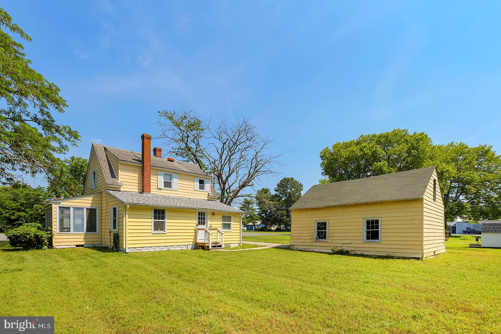 29092 Piney Neck Road Dagsboro, DE 19939 - Photo 34 of 49 a view of a house with a big yard and large trees