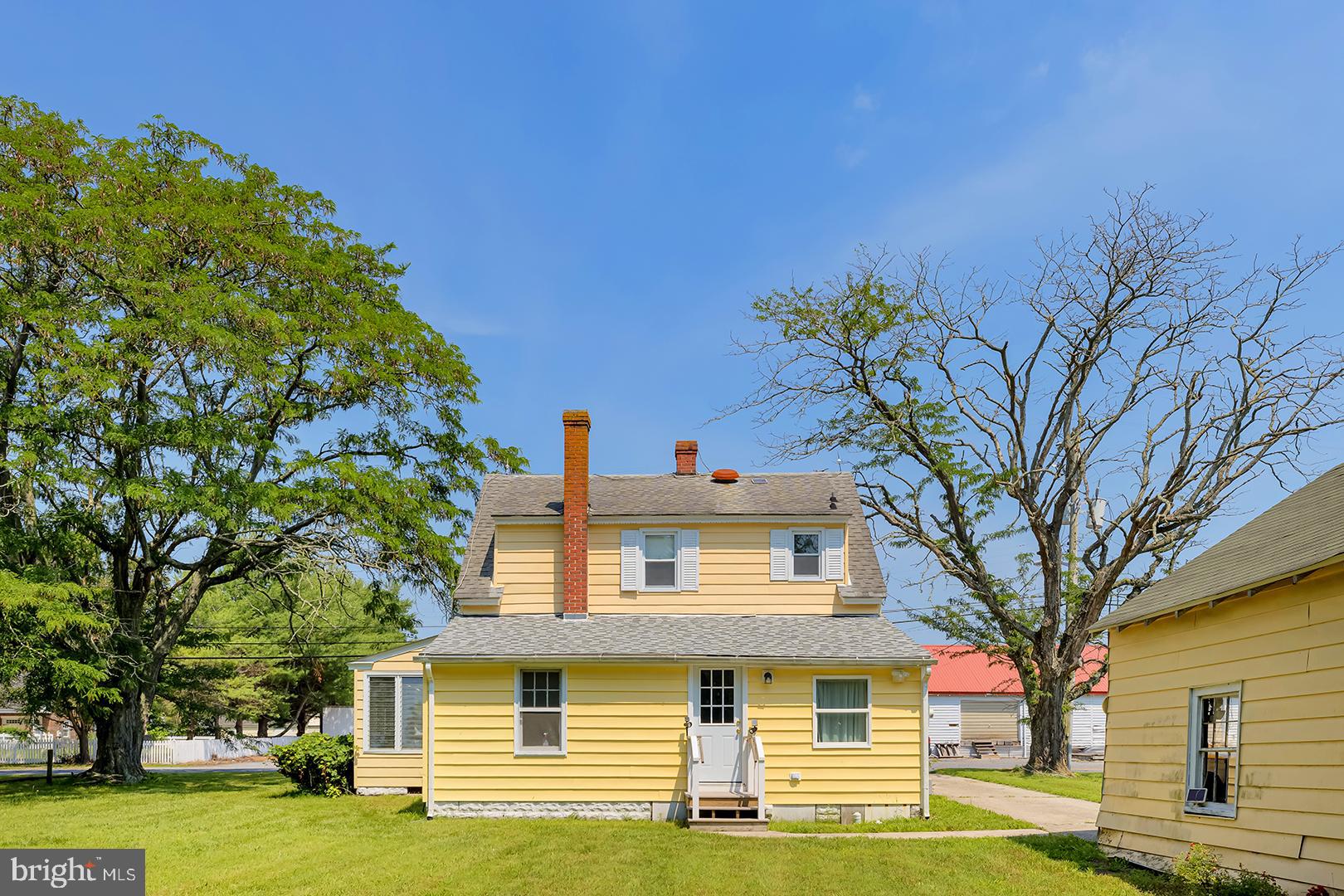 29092 Piney Neck Road Dagsboro, DE 19939 - Photo 35 of 49 a front view of a house with a garden