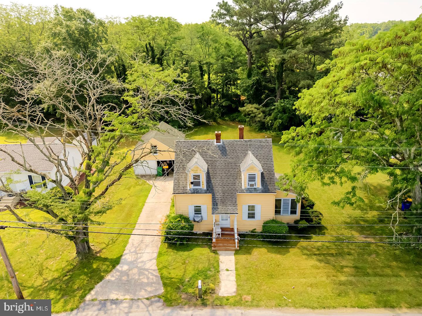 29092 Piney Neck Road Dagsboro, DE 19939 - Photo 4 of 49 an aerial view of a house with swimming pool and large trees