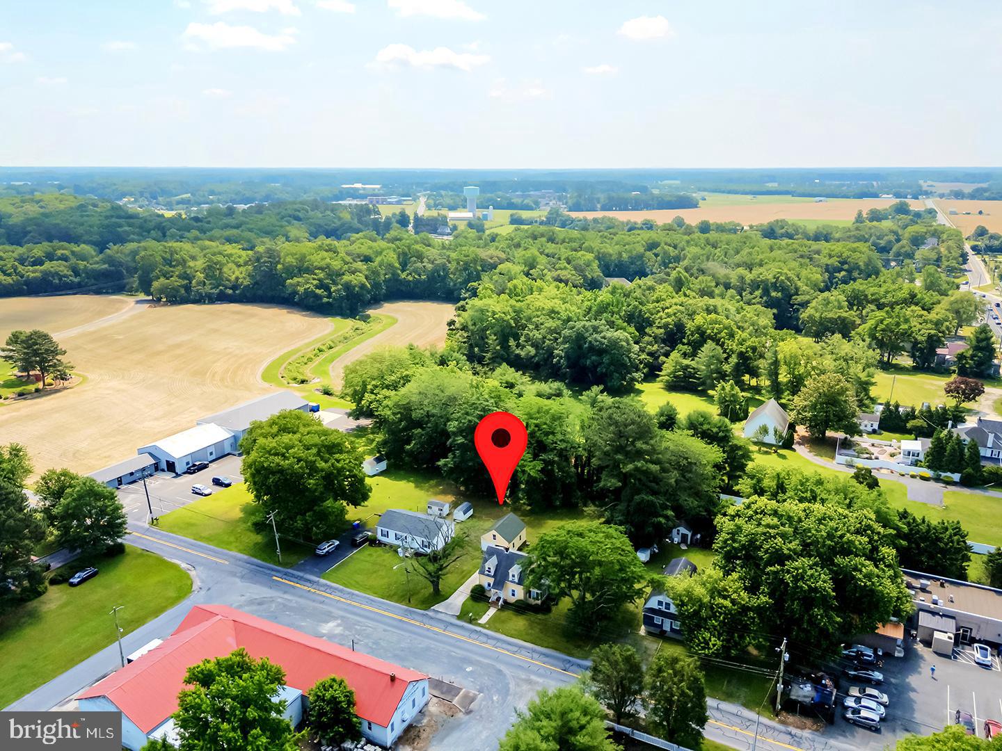 29092 Piney Neck Road Dagsboro, DE 19939 - Photo 47 of 49 an aerial view of a house with a yard and lake view