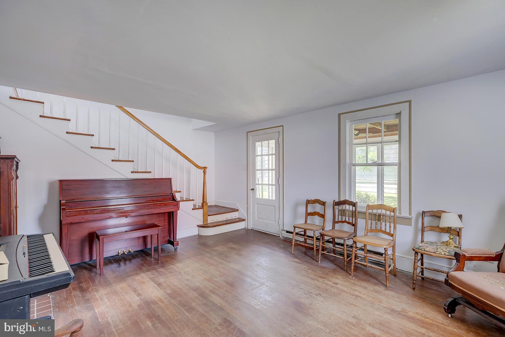 29092 Piney Neck Road Dagsboro, DE 19939 - Photo 5 of 49 a living room with furniture and a piano