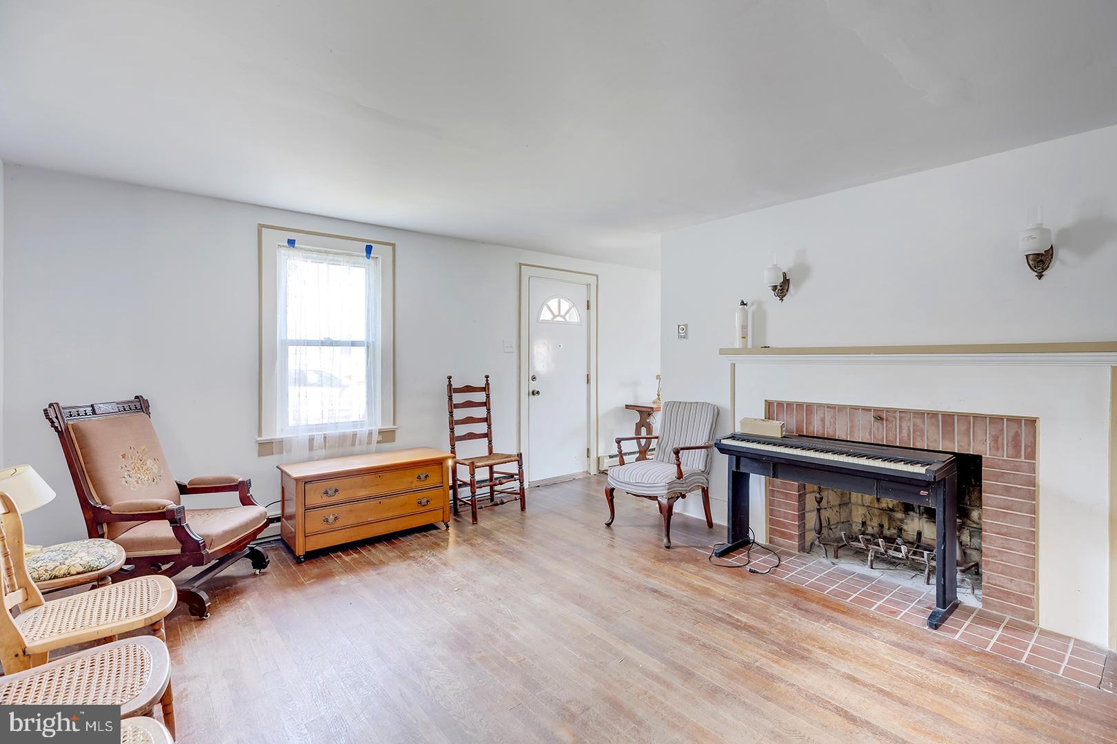 29092 Piney Neck Road Dagsboro, DE 19939 - Photo 6 of 49 a living room with furniture a piano and a window