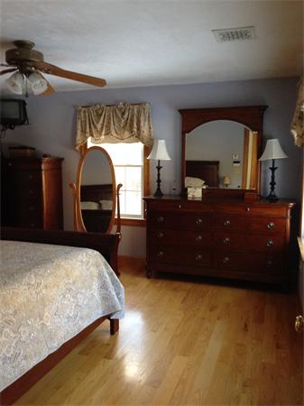 10 Adams Road Townsend, MA 01469 - Photo 17 of 30 a bedroom with a bed and a dresser