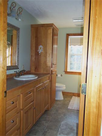 10 Adams Road Townsend, MA 01469 - Photo 18 of 30 a spacious bathroom with a double vanity sink a large mirror and a bathtub
