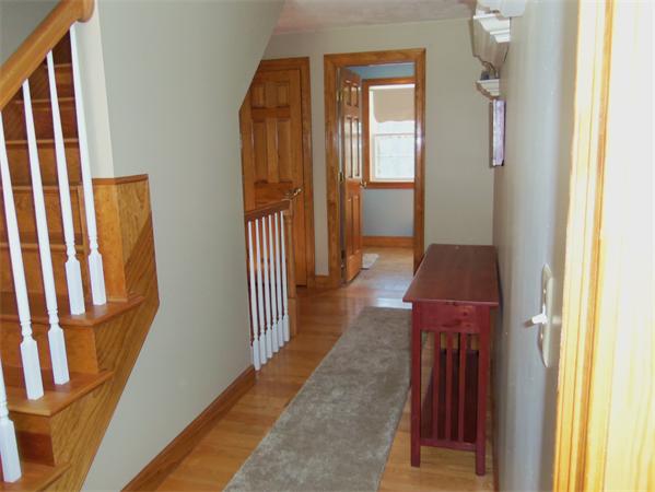 10 Adams Road Townsend, MA 01469 - Photo 23 of 30 a hallway with wooden floor stairs
