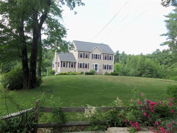 10 Adams Road Townsend, MA 01469 - Photo 3 of 30 a front view of a house with a garden