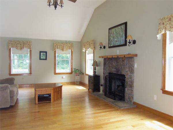 10 Adams Road Townsend, MA 01469 - Photo 4 of 30 a living room with furniture and a fireplace