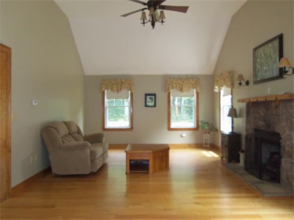 10 Adams Road Townsend, MA 01469 - Photo 5 of 30 a living room with furniture and a fireplace