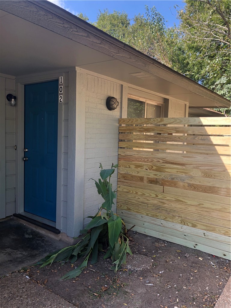 6502 South 1st Street, Unit 102 Austin, TX 78745 - Photo 1 of 26 a view of house with backyard space