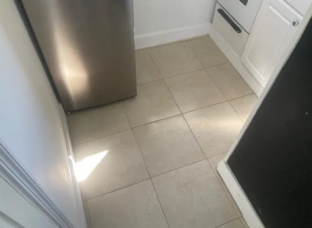 a bathroom with a shower and a window