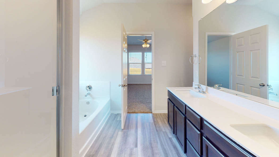 246 Water Wl Road Burnet, TX 78611 - Photo 7 of 16 a bathroom with a sink a mirror and a bathtub