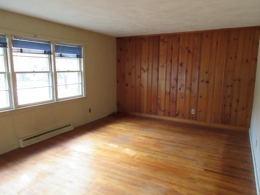 193 Ryan Road Northampton, MA 01062 - Photo 3 of 19 an empty room with wooden floor and windows