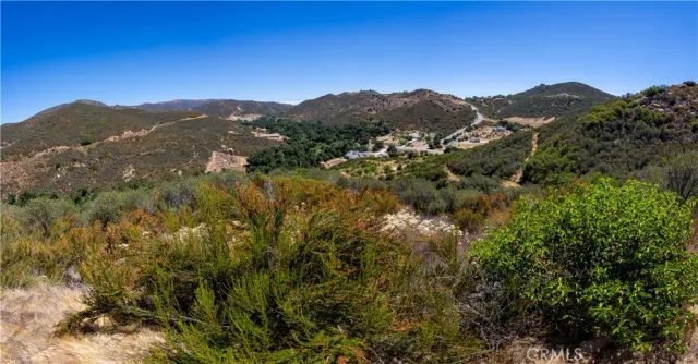 a view of a mountain range with mountains in the background