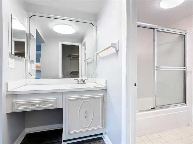 a bathroom with a sink a vanity and a mirror