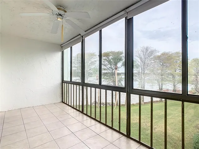 a view of an empty room and a window