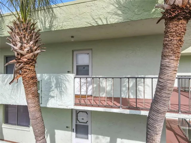 a view of balcony and wooden floor