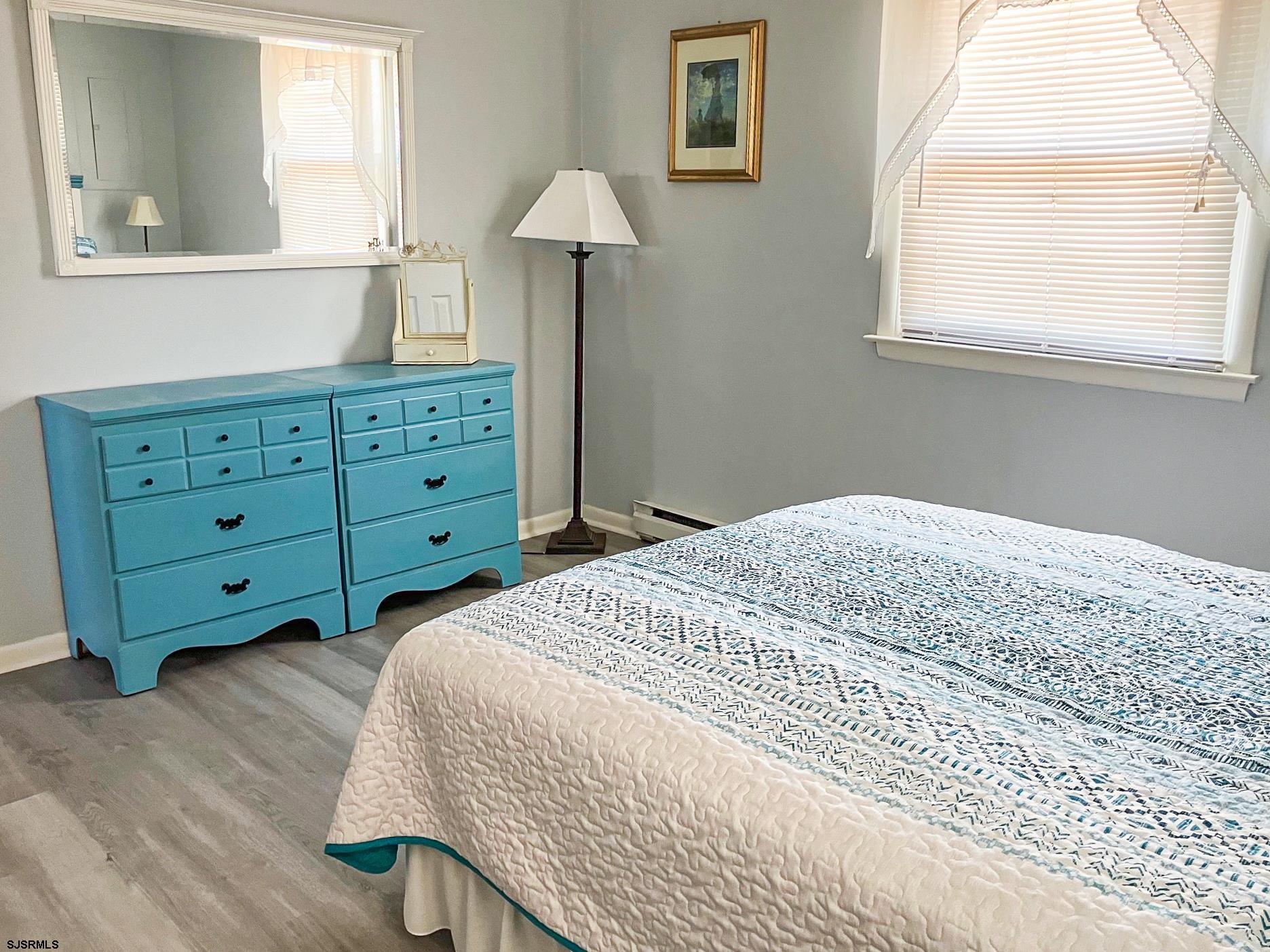 335 42nd Street South, Unit FIRST Brigantine, NJ 08203 - Photo 20 of 23 a bedroom with a bed and a window