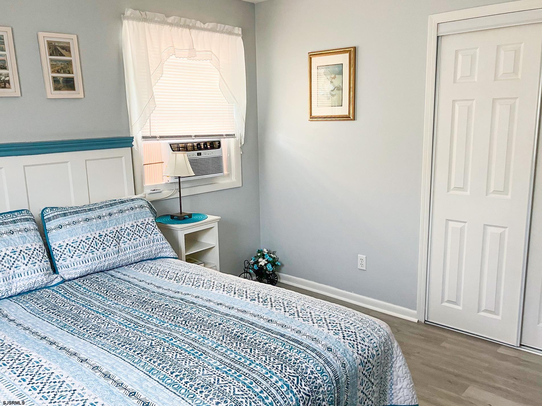 335 42nd Street South, Unit FIRST Brigantine, NJ 08203 - Photo 3 of 23 a bedroom with a bed and a window