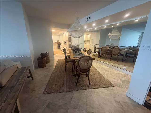 a kitchen with stainless steel appliances a white stove top oven and a refrigerator