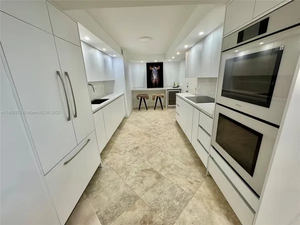 a view of room with furniture and wooden floor