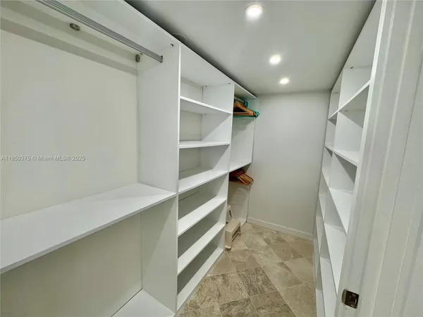 a bathroom with a toilet and a bath tub