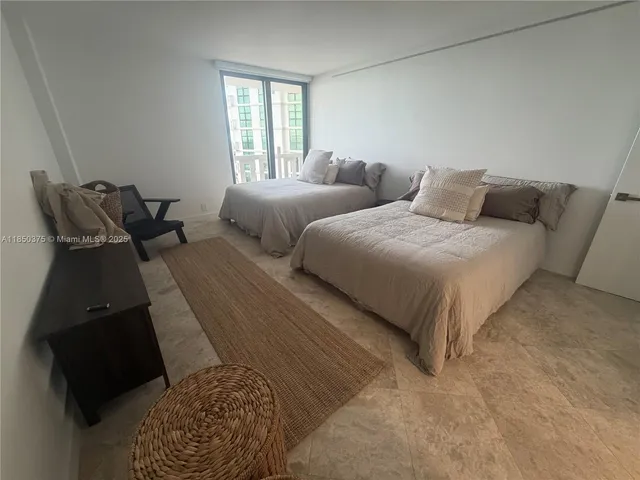 a living room with furniture and a book shelf