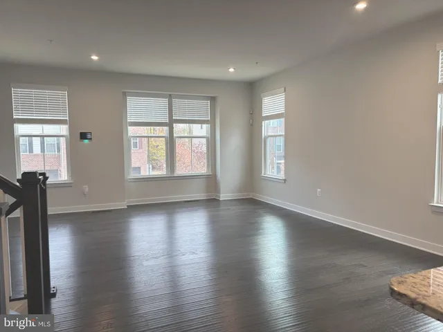a kitchen with a stove a sink a counter space appliances and cabinets