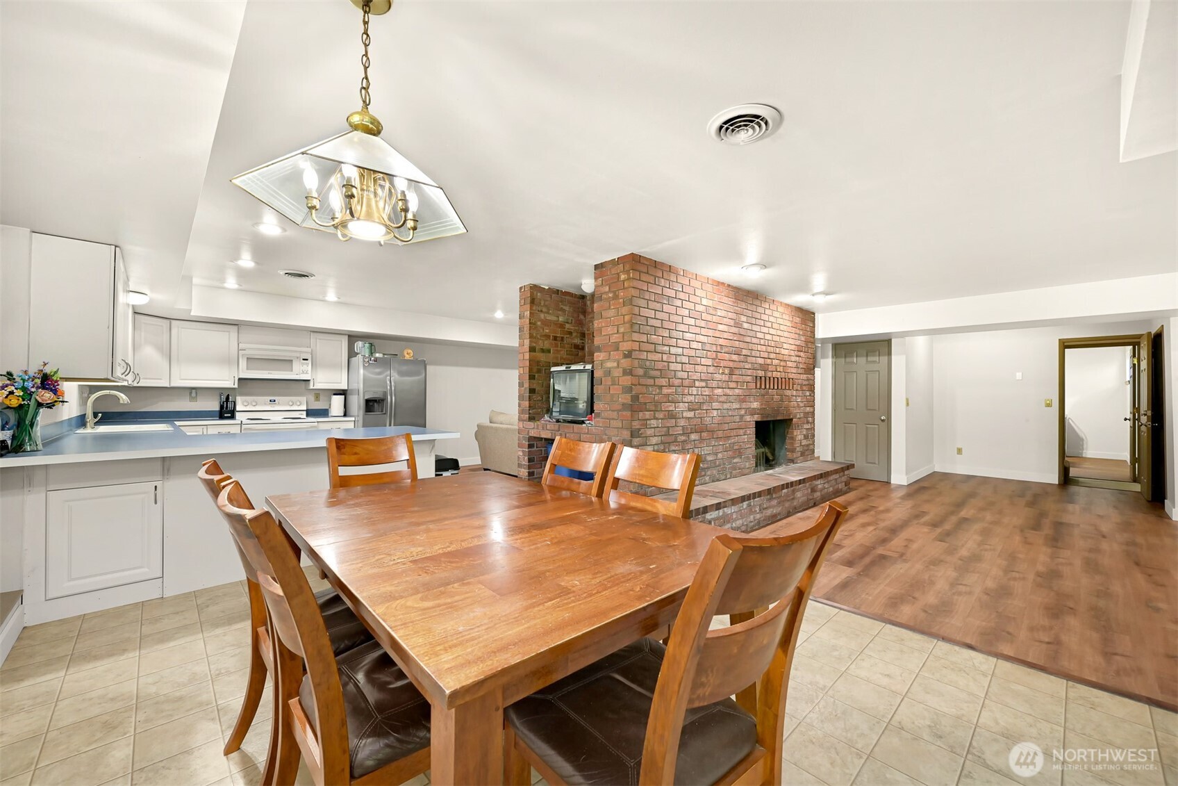 1300 West Axton Road Ferndale, WA 98248 - Photo 15 of 40 a view of a dining room with furniture a chandelier and wooden floor