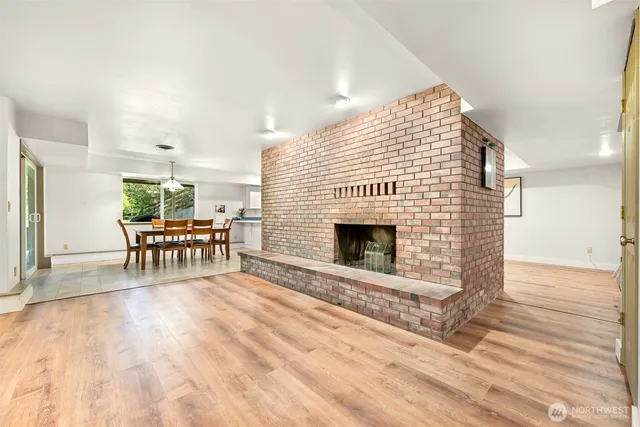 a view of a livingroom with furniture window and wooden floor