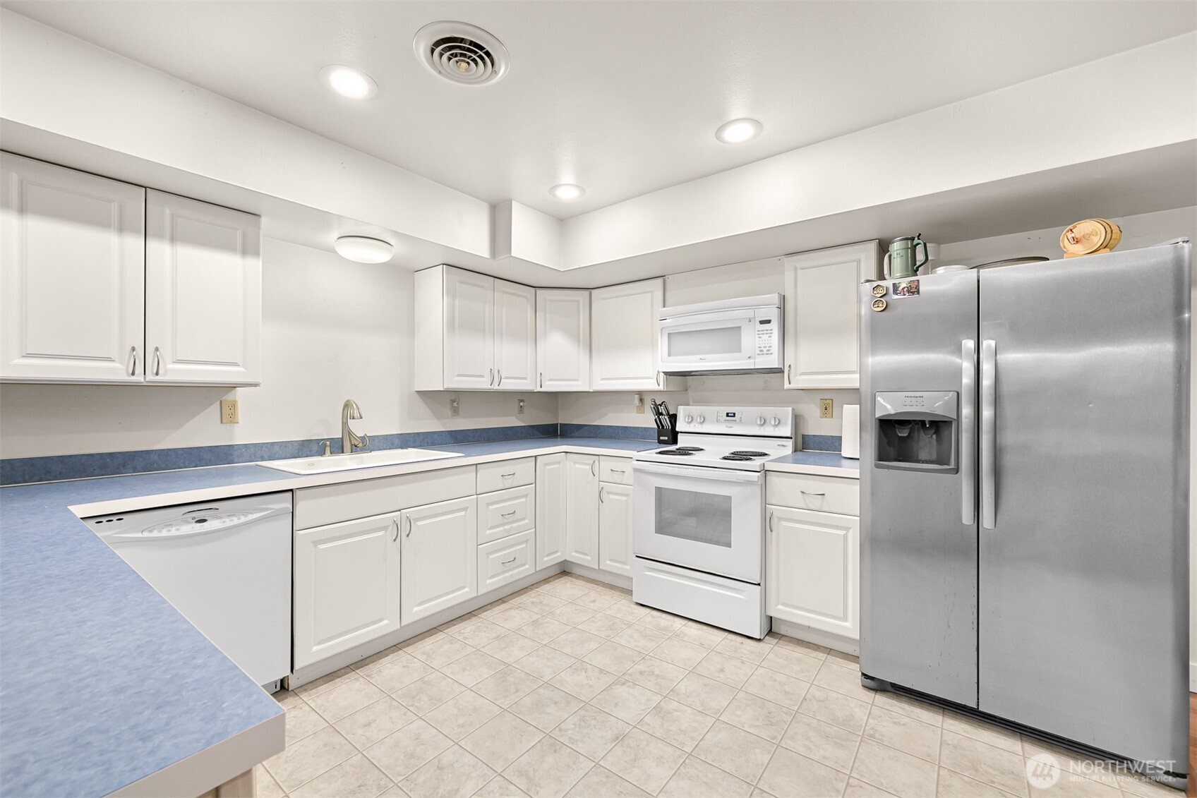 1300 West Axton Road Ferndale, WA 98248 - Photo 19 of 40 a kitchen with cabinets and stainless steel appliances