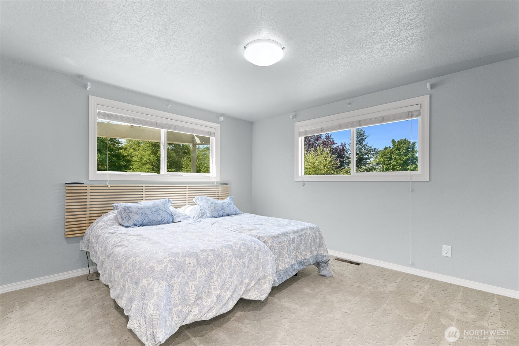 1300 West Axton Road Ferndale, WA 98248 - Photo 21 of 40 a bedroom with a bed and a painting on the wall