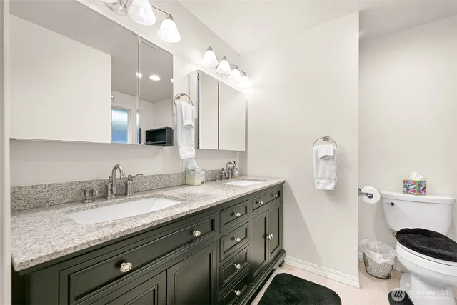 a view of a sink and washer dryer
