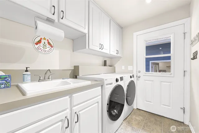 a living room with patio furniture and a table