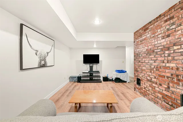 a bathroom with a double vanity sink mirror and toilet