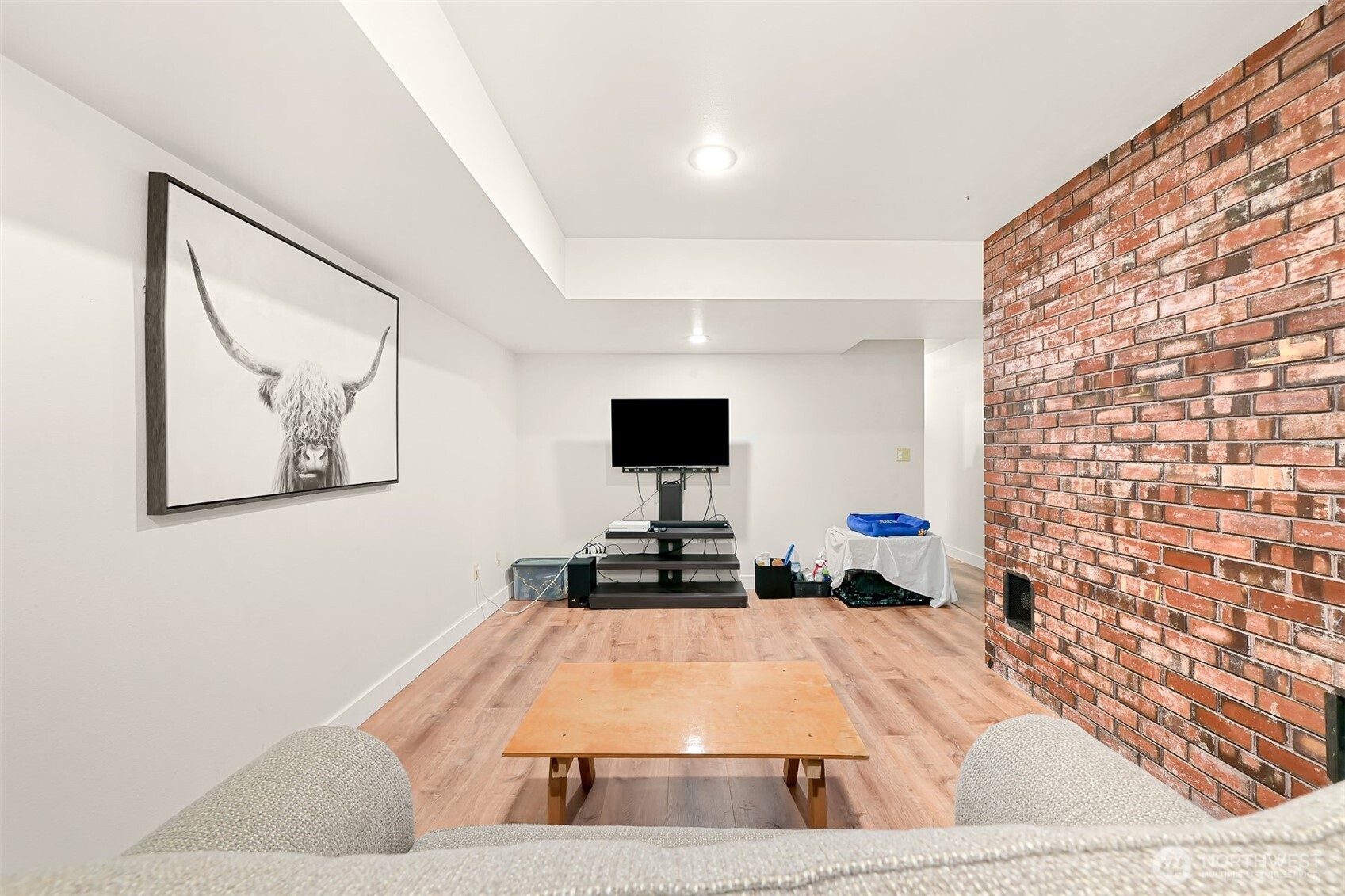 1300 West Axton Road Ferndale, WA 98248 - Photo 28 of 40 a living room with a couch and a flat screen tv