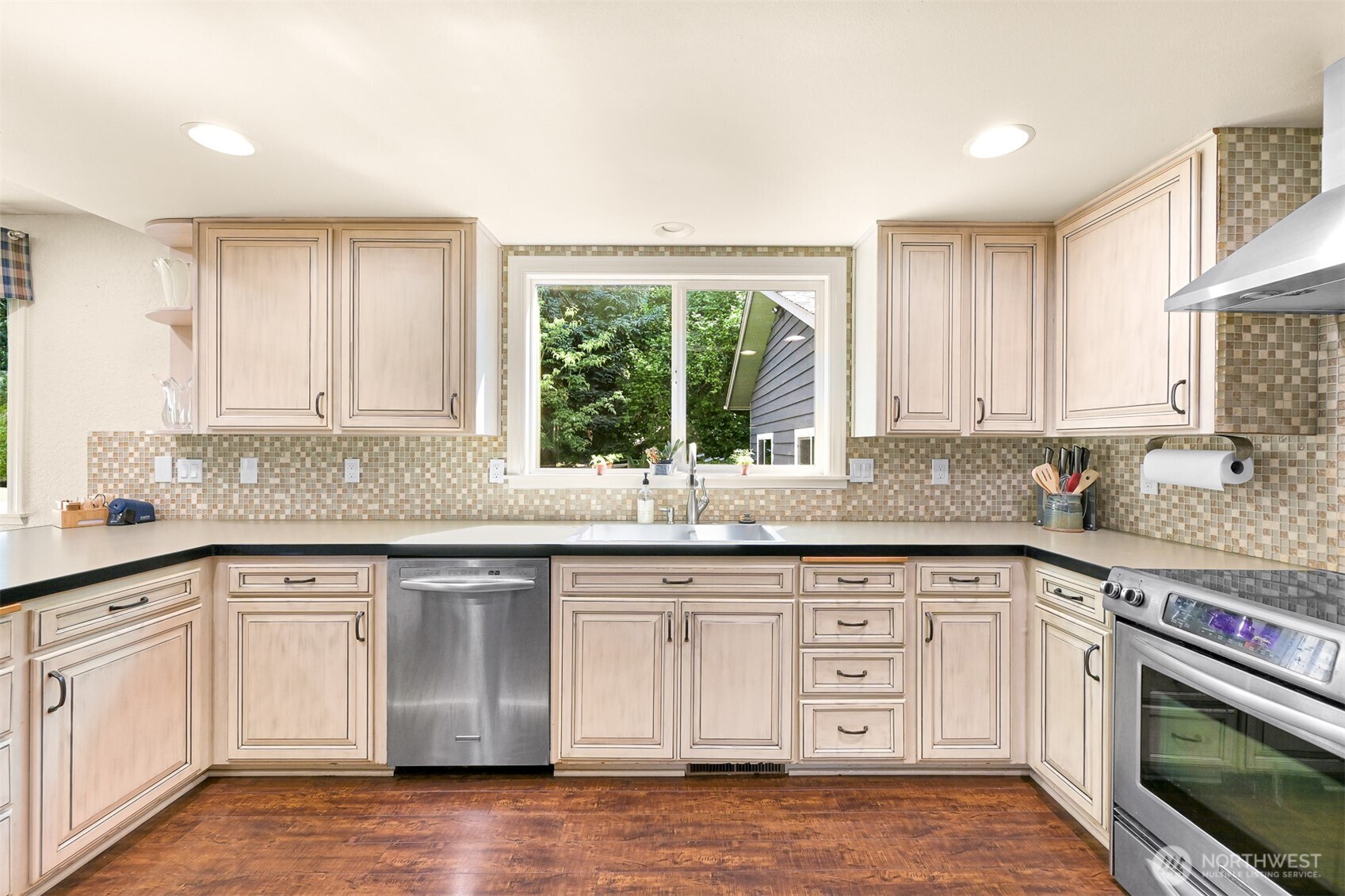 1300 West Axton Road Ferndale, WA 98248 - Photo 10 of 40 a kitchen with granite countertop white cabinets and a window