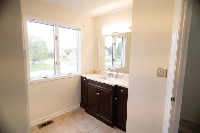 a view of an empty room and window