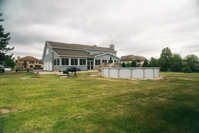 a front view of a house with a swimming pool