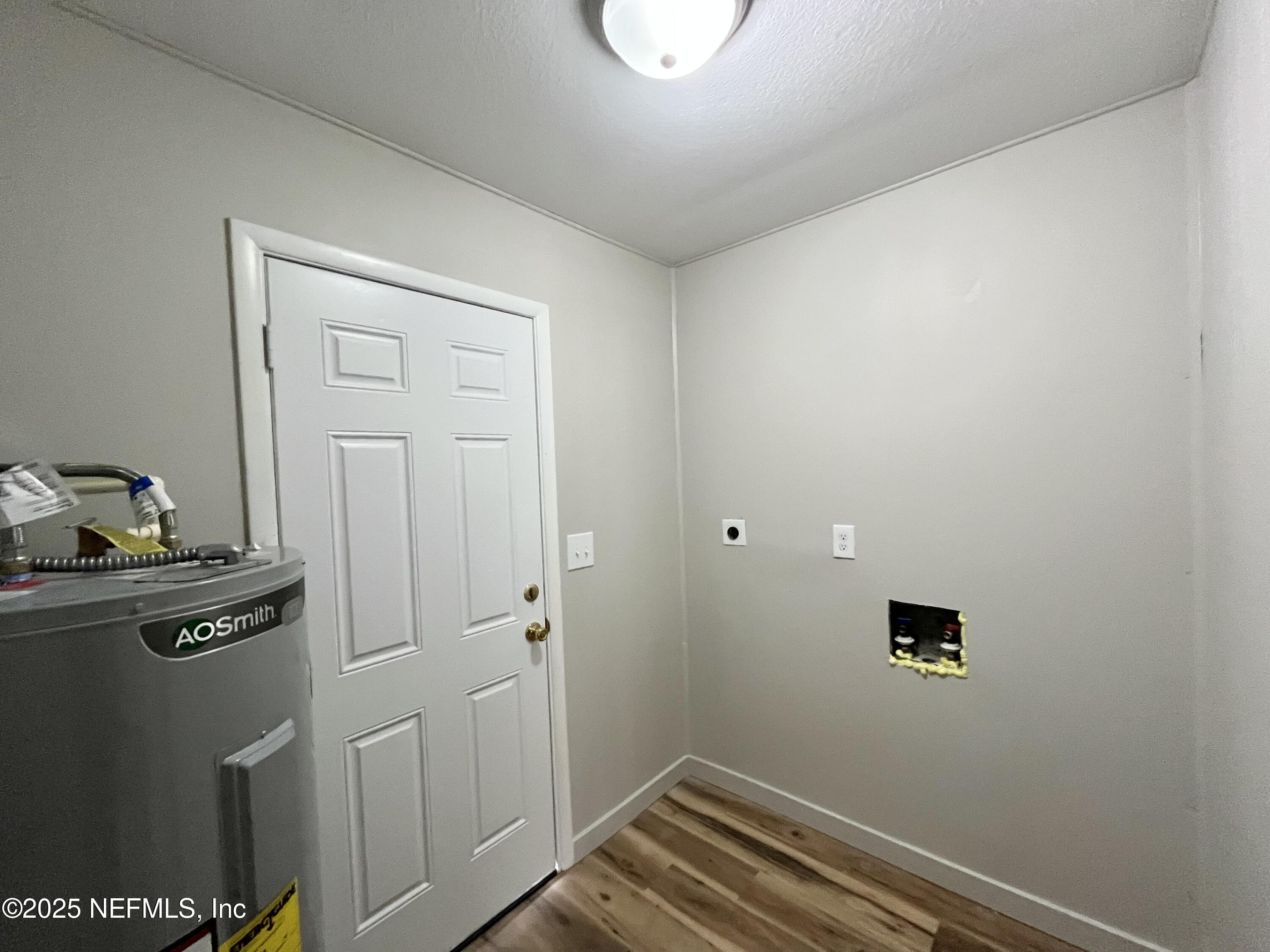 7013 1st Street St. Augustine, FL 32092 - Photo 13 of 16 Laundry room and door to backyard