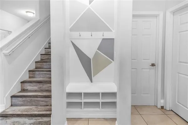 a view of entryway and hall with a front door