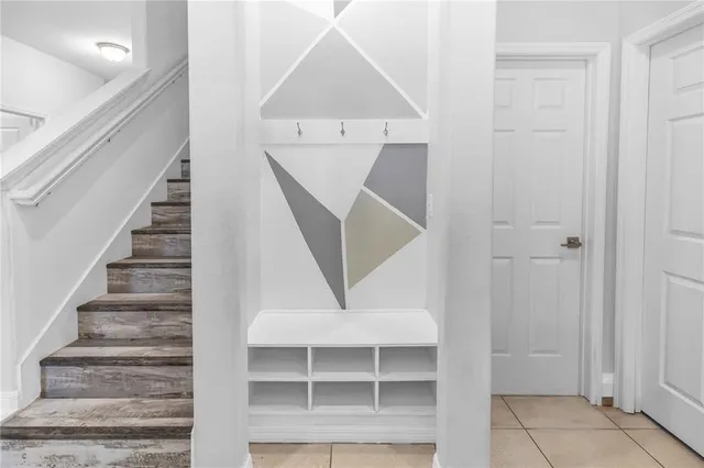 a view of entryway and hall with a front door