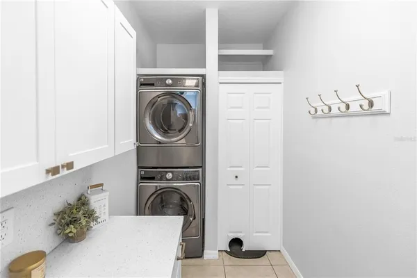 a view of a kitchen with washer and dryer