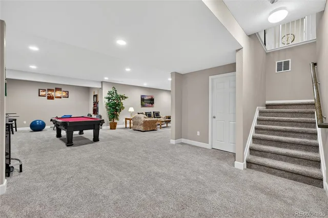 a living room with furniture and a table