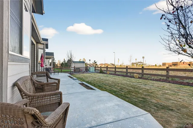 a view of a terrace with couches and a fire pit